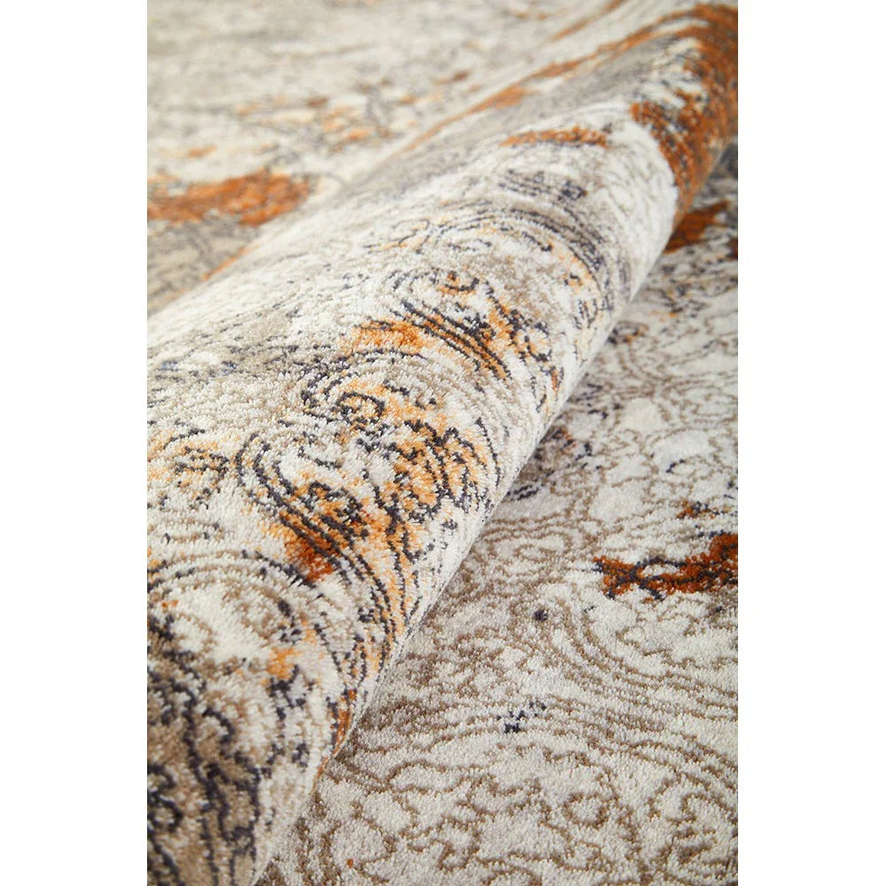 Melody Gayle Multi Rug featuring distressed floral pattern in cream, beige, rust and navy on ivory background, machine-woven polypropylene
