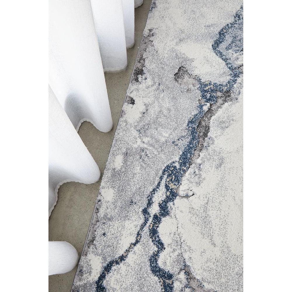 Geode Blue Runner Rug featuring geode/mineral pattern in navy blue, royal blue, light grey and ivory on beige background, machine-made rug