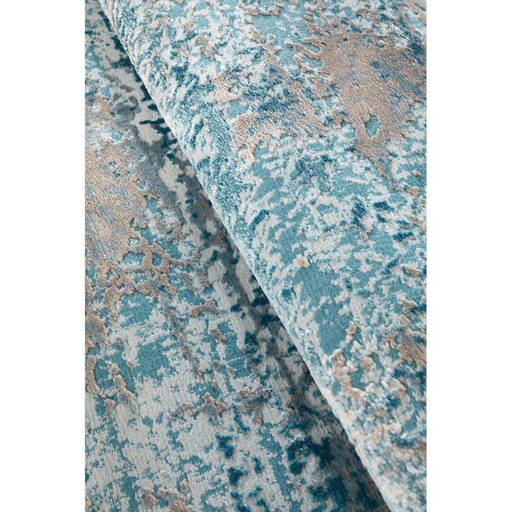 Lux Olivia Blue Runner Rug featuring abstract distressed pattern in teal blue, sky blue and beige on ivory background, machine-made wool blend