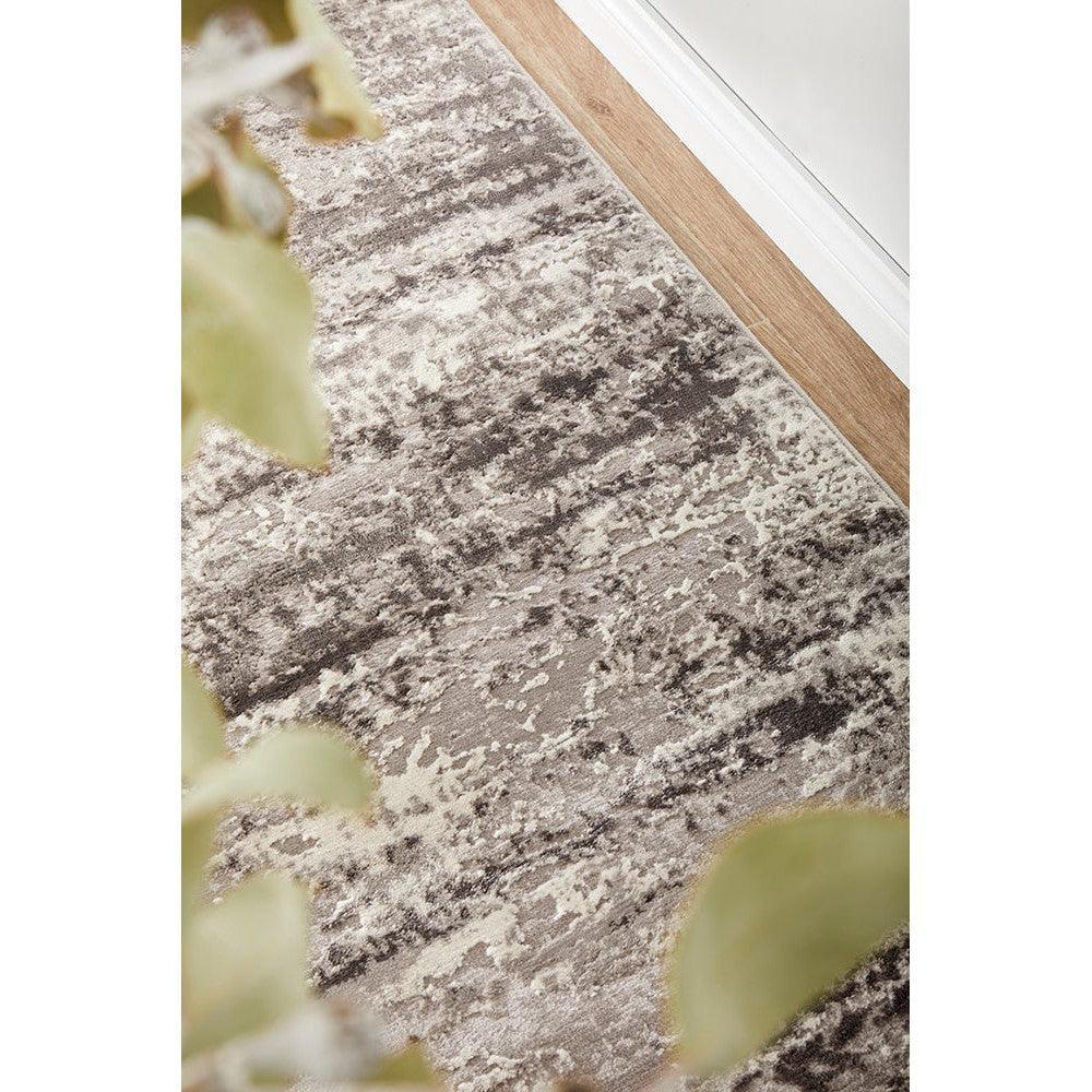 Lux Sophia Silver Runner Rug featuring abstract distressed pattern in silver, charcoal and cream on beige background, hand-tufted wool
