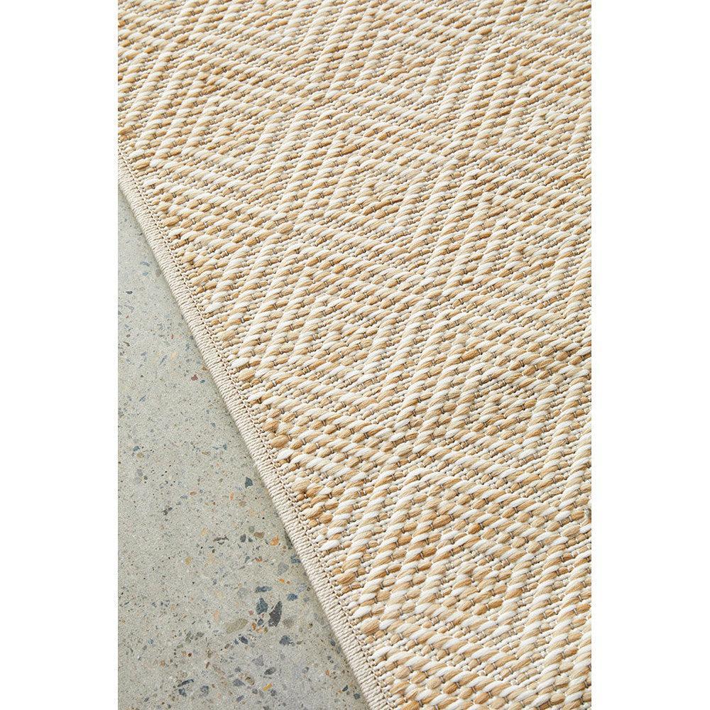 Patio Misty Natural Runner Indoor-Outdoor Rug featuring braided geometric pattern in natural beige and ivory on grey background, hand-woven jute