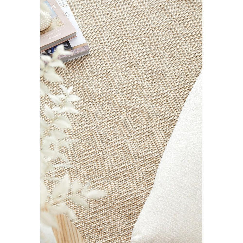 Patio Misty Natural Indoor-Outdoor Rug featuring woven textured pattern in beige, tan and cream on light ivory background, power-loomed polypropylene