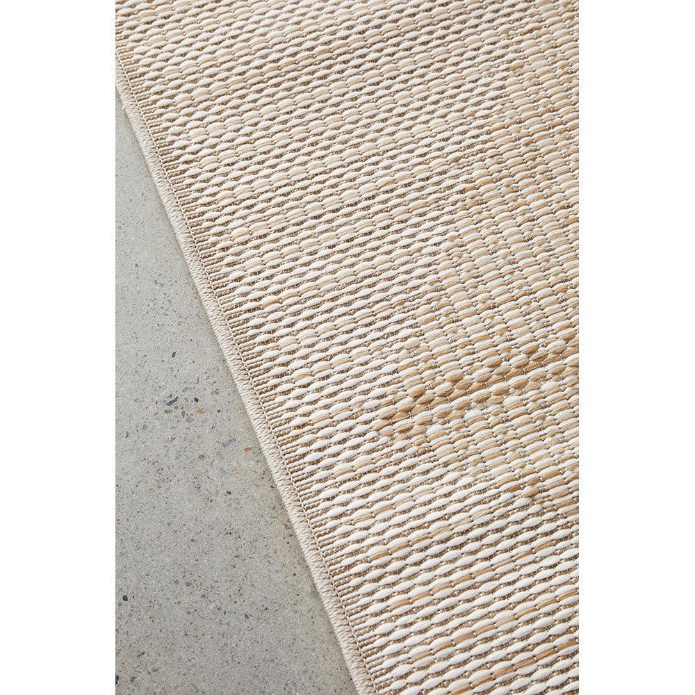 Patios Rico Natural Runner rug featuring woven basketweave in beige, taupe and natural on light concrete background, hand-woven jute