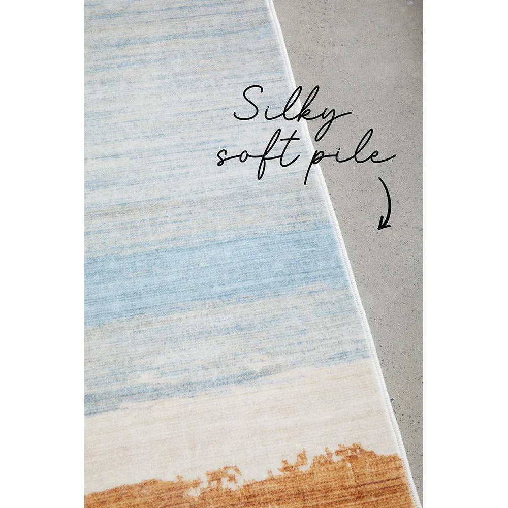 Revive Brody Tan Washable Rug featuring gradient stripe in light blue, cream and tan on ivory background, machine-made polyester