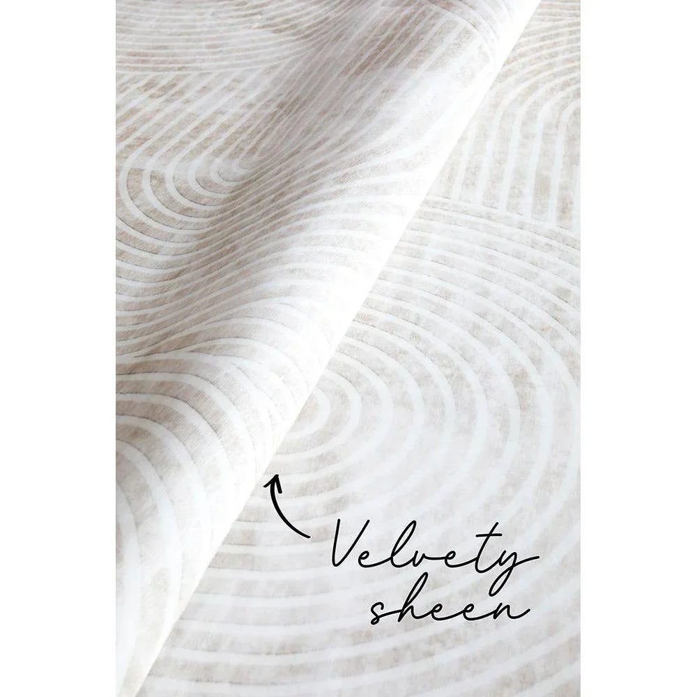 Revive Byron Natural Washable Rug featuring concentric circle pattern in cream, beige and taupe on ivory background, machine-woven polyester blend
