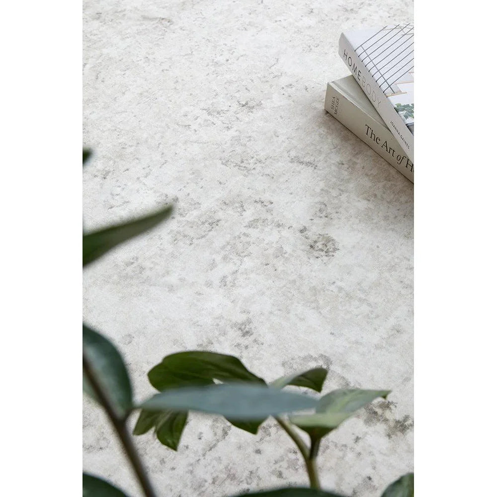 Revive Isla Marble Washable Rug featuring marble pattern in ivory, cream and light grey on pale beige background, machine-washable rug