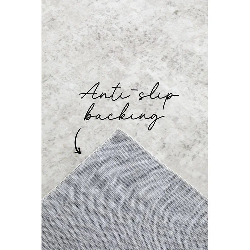 Revive Isla Marble Washable Rug featuring marble-textured pattern in light grey and ivory on pale background, anti-slip backing, machine-woven polyester