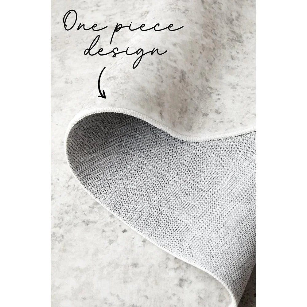 Revive Isla Marble Washable Rug featuring marble pattern in ivory, light grey and charcoal on cream background, machine-washable fabric