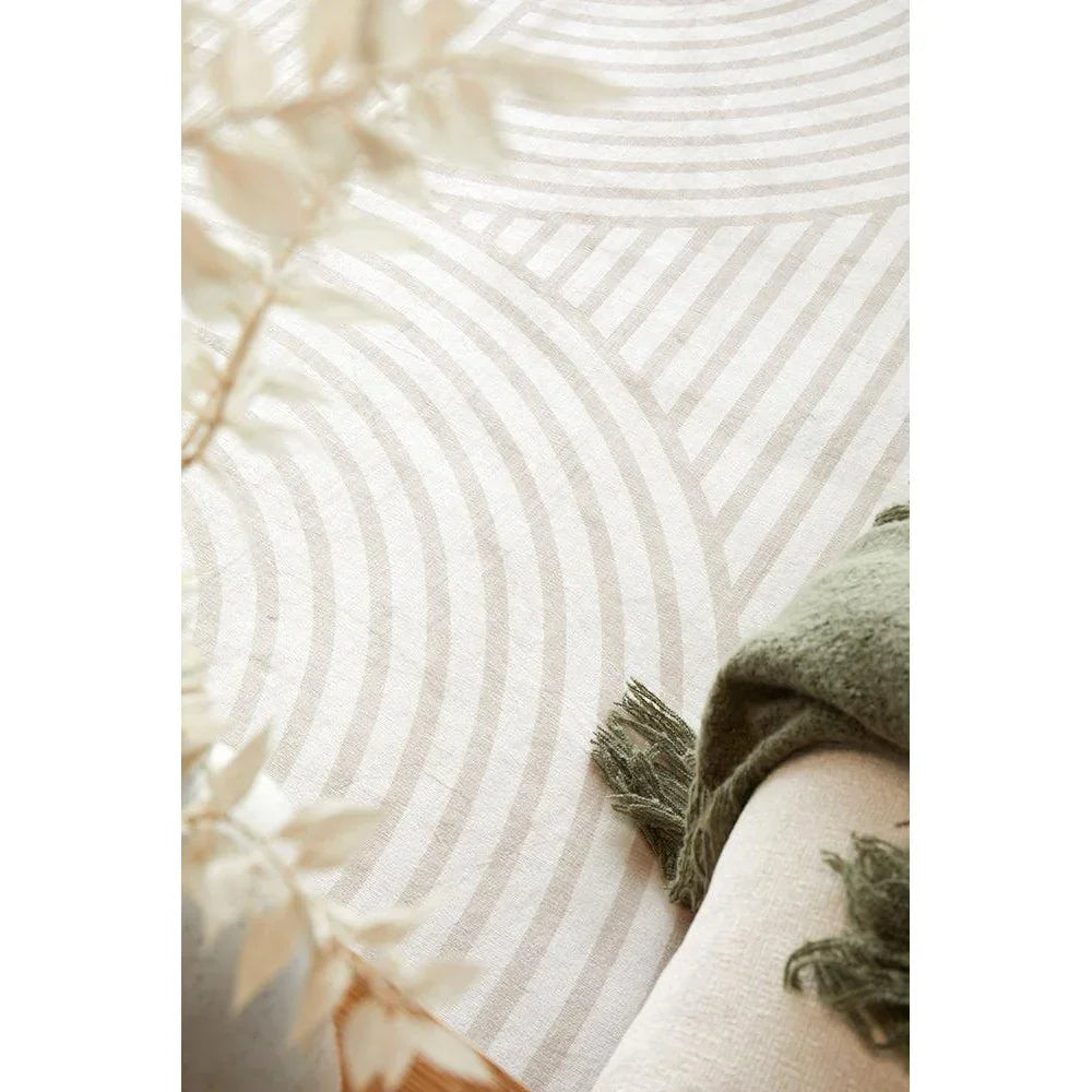 Revive Jett Natural Washable Rug featuring circular geometric pattern in cream and taupe on ivory background, machine-made rug