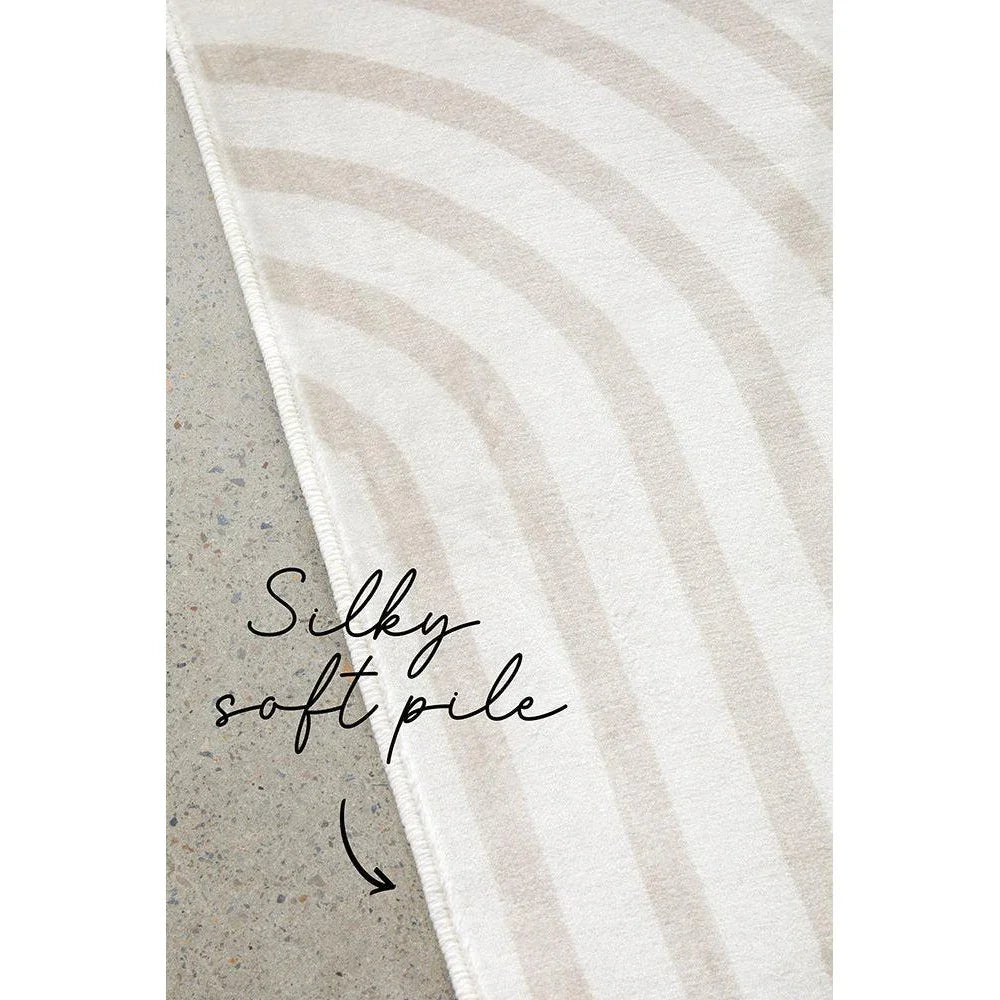 Revive Jett Natural Washable Rug featuring curved beige stripes on white background, silky soft pile, machine-made rug