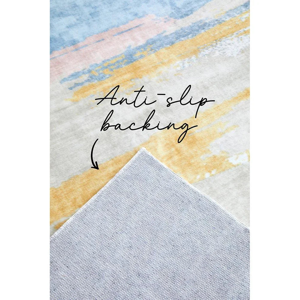Revive Tyler Multi Washable Rug with abstract painterly pattern in pastel blue, pink, ochre on cream; machine-woven polypropylene