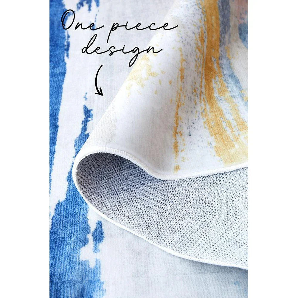 Revive Tyler Multi Washable Rug featuring abstract watercolor pattern in cobalt blue, sky blue, mustard yellow on white background, machine-made polyester