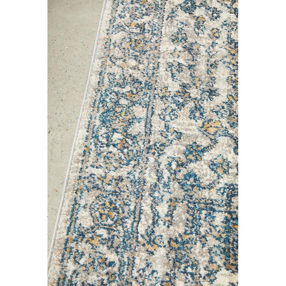 Sasha Blue Runner Rug featuring vintage floral pattern in navy blue, teal, ivory and mustard on cream background, hand-tufted wool