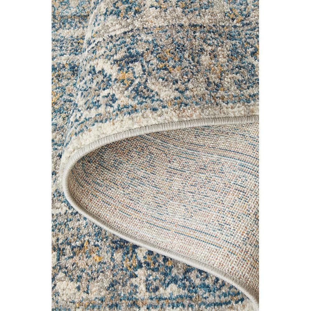 Sasha Blue Runner Rug featuring distressed abstract pattern in navy, sky blue, ivory and beige on cream background, machine-made polypropylene