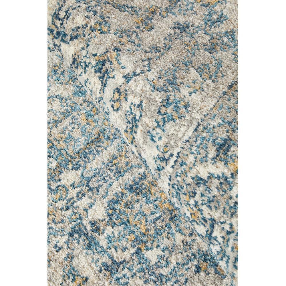 Sasha Blue Runner Rug featuring abstract pattern in blue, teal, beige and ivory on cream background, machine-woven polypropylene