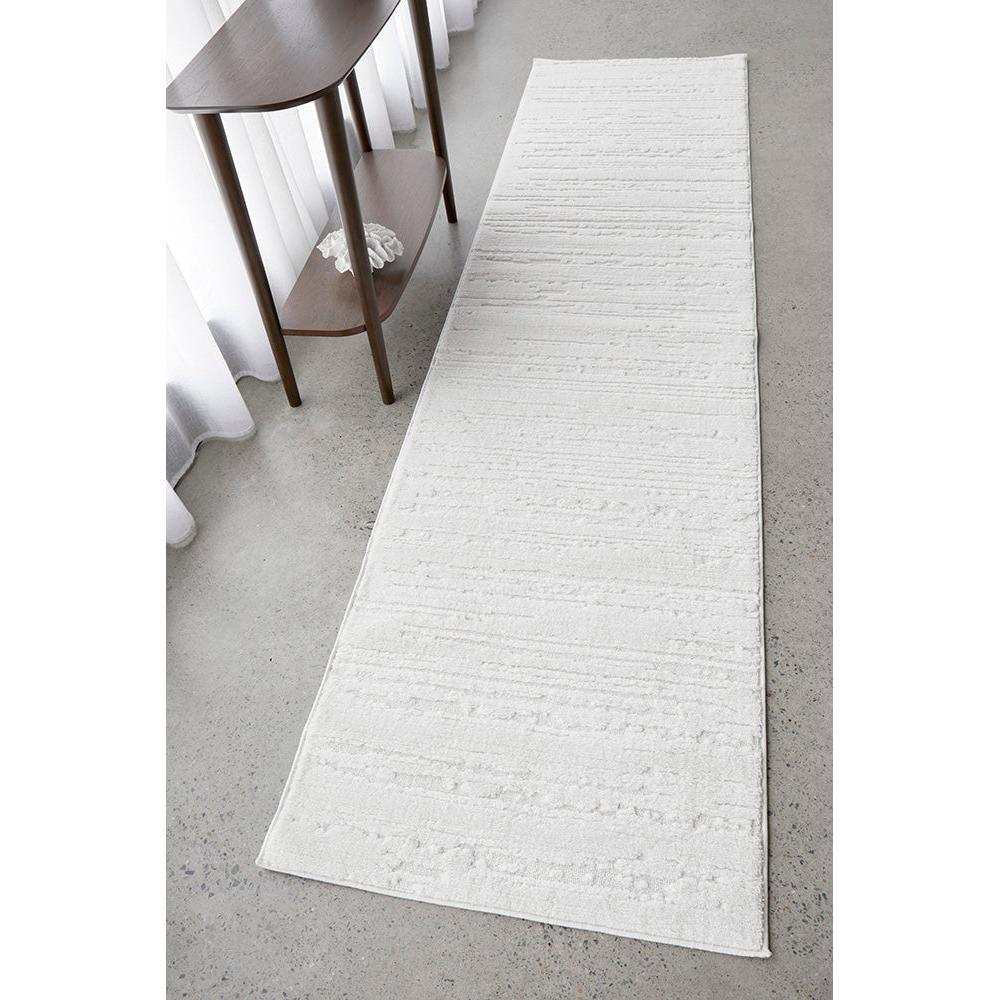 Serene Ezra White Runner Rug featuring contemporary linear pattern in ivory/white on light grey floor, hand-tufted wool