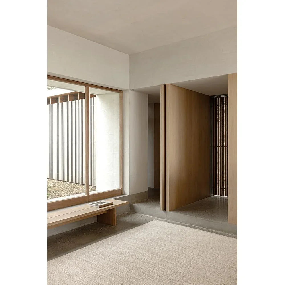 Steph And Gian Birch Flax Rug featuring a minimalist flat-weave in cream, beige and sand on light ivory background, handwoven flax