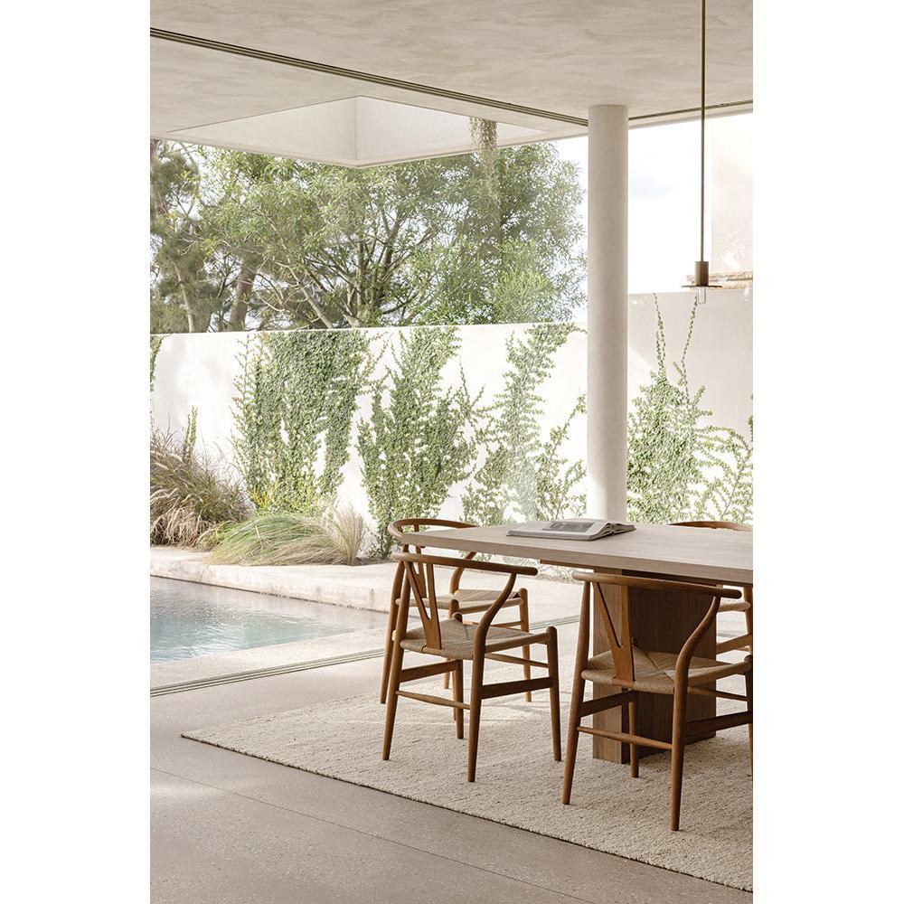 Steph And Gian Elm Pepper Rug featuring textured solid weave in cream, beige and taupe on light grey floor, woven wool