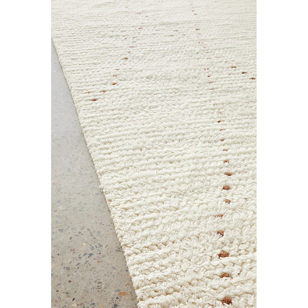 Summit Daina Natural rug featuring textured weave and dotted pattern in ivory and light tan on natural background, woven wool