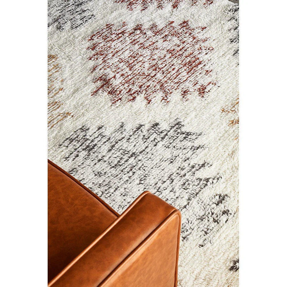 Summit Motif Cream rug featuring abstract motif in rust red, charcoal, taupe & cream on cream background, hand-tufted wool