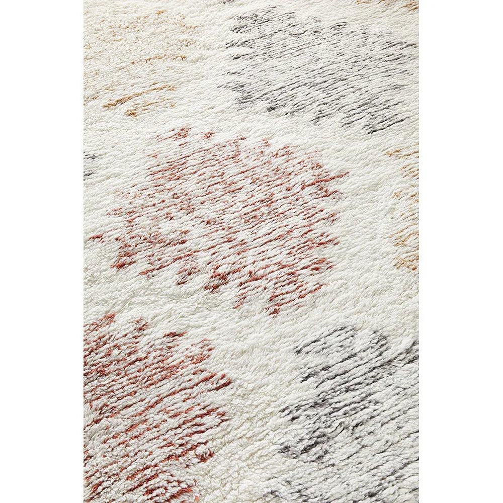 Summit Motif Cream rug featuring abstract patchwork in rust, charcoal grey, taupe and ochre on cream, hand-tufted wool