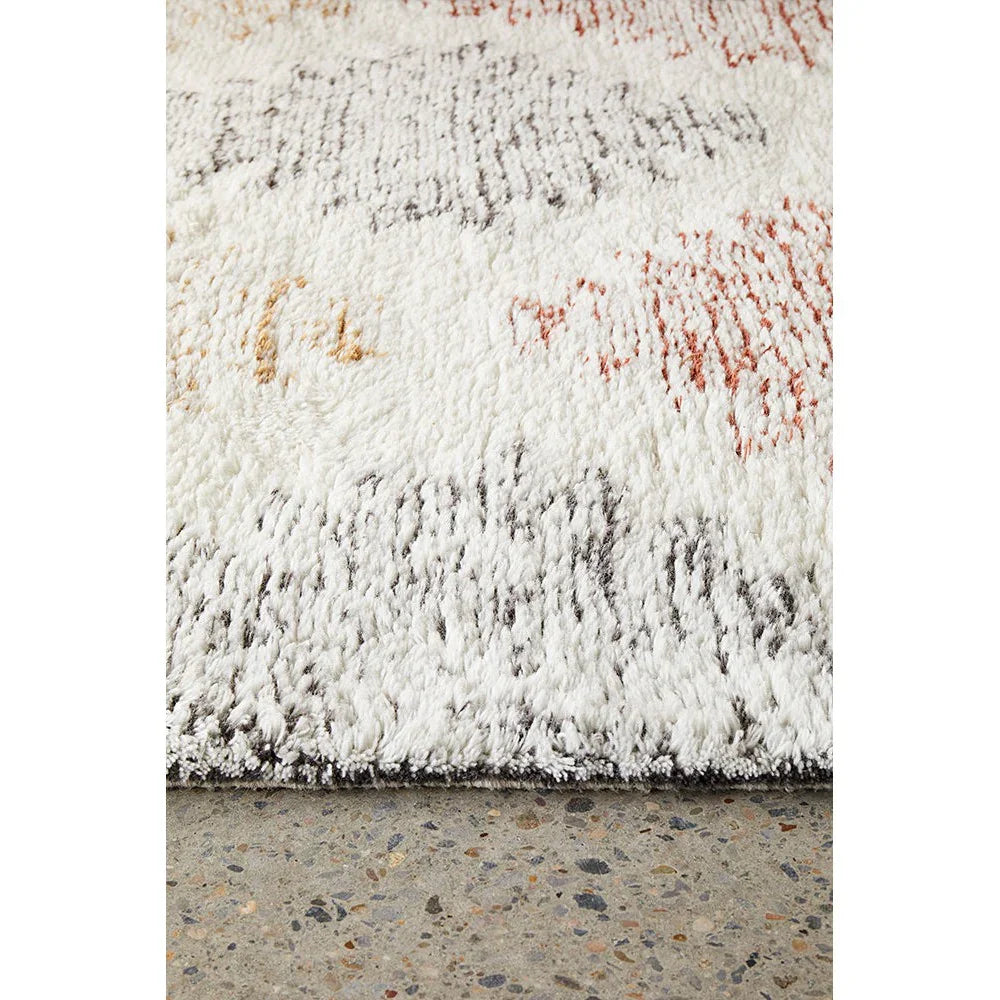 Rug Culture Summit Motif Cream rug with abstract motif in cream, grey, black, rust and mustard on cream, hand-tufted wool