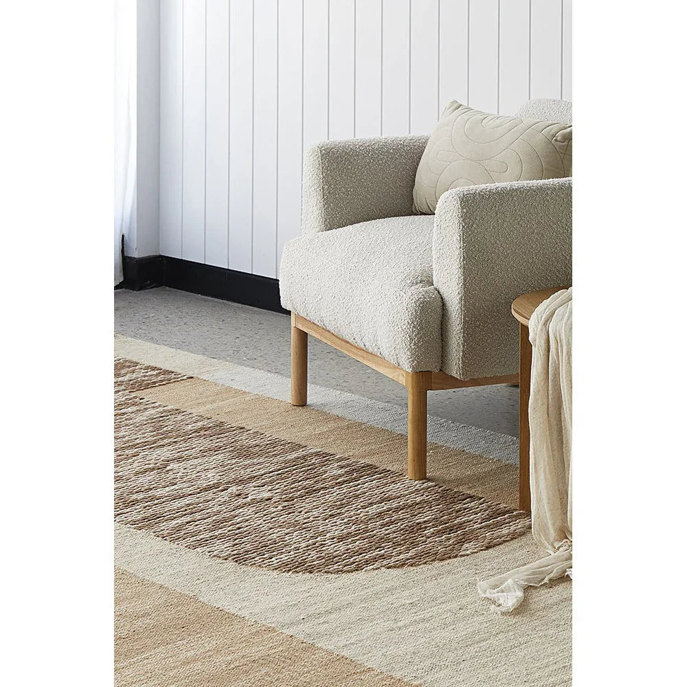 Summit Orb Toffee rug featuring geometric circular motif in toffee, cream and beige on cream background, machine-made polyester rug