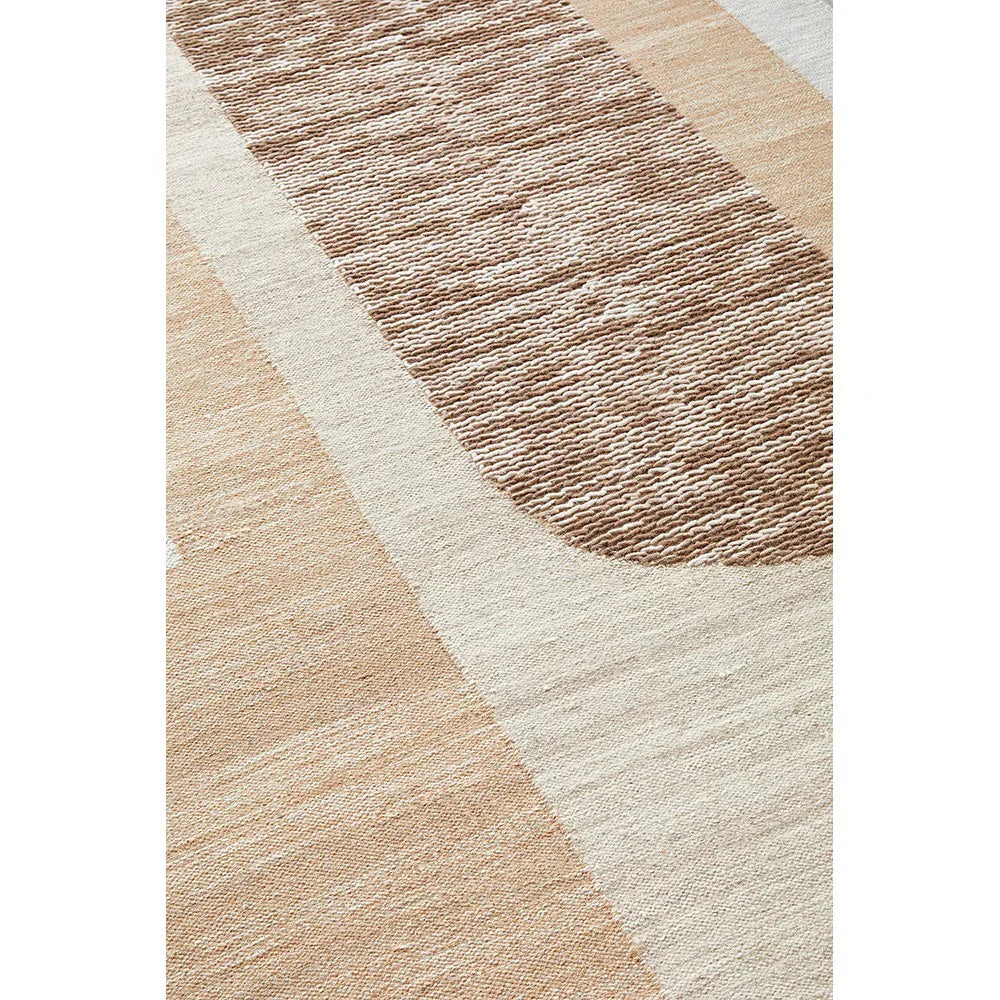 Summit Orb Toffee rug featuring abstract curved stripe pattern in beige, taupe and cream on warm cream background, woven rug