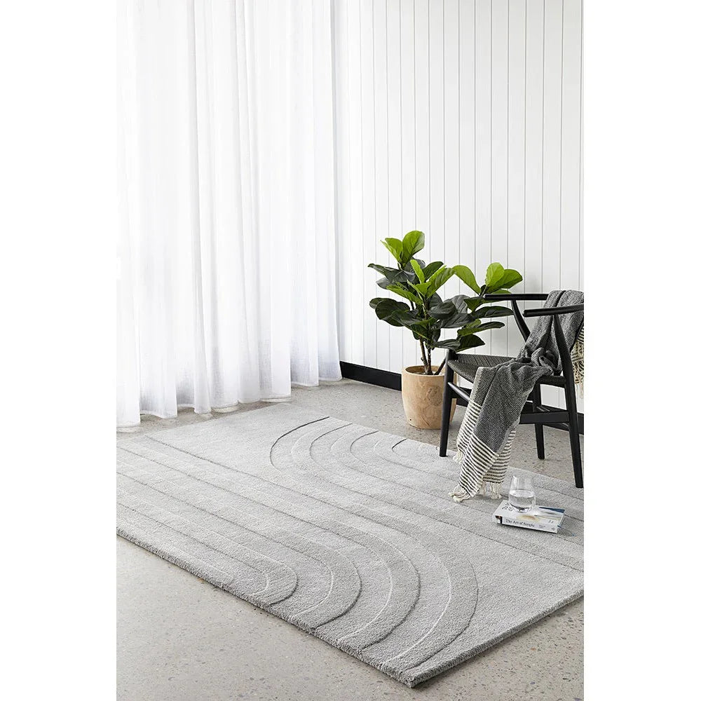 Summit Trail Grey rug featuring curved arc pattern in light grey on mid-grey background, machine-made polypropylene