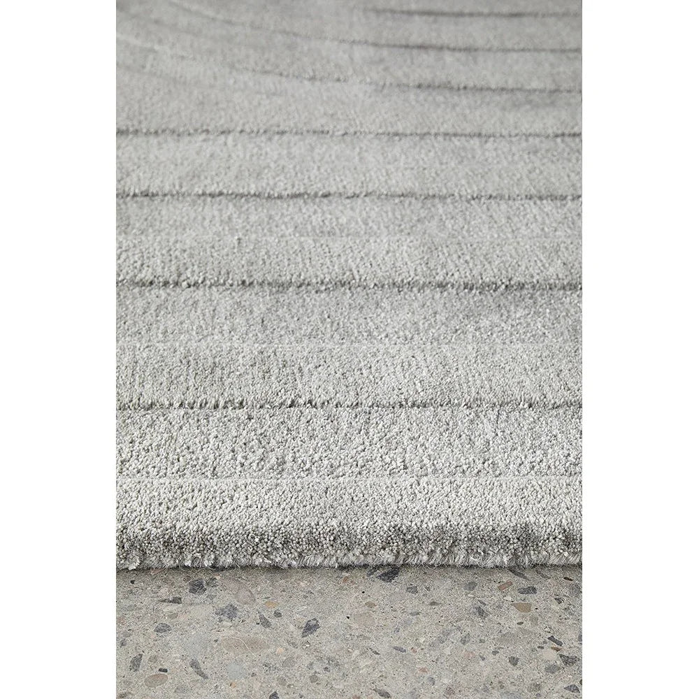 Summit Trail Grey rug featuring striped textured pattern in light grey, charcoal grey and ivory on cream background, machine-made wool