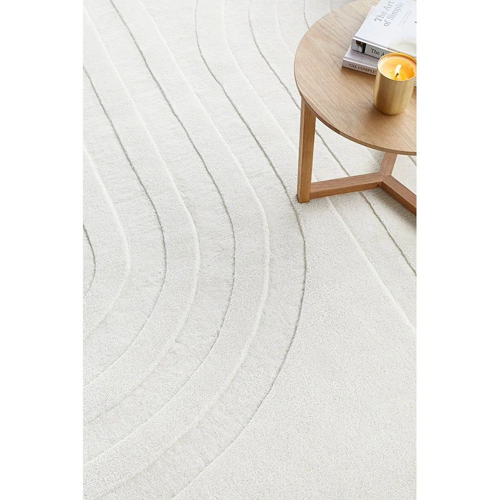 Summit Trail White rug featuring circular wave pattern in ivory, cream and light grey on cream background, machine-made wool blend