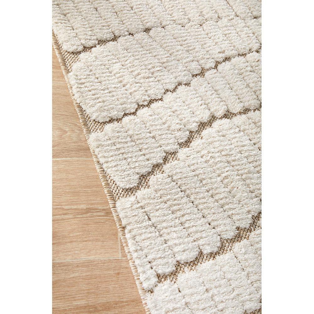 Villa Fossil Cream Rug featuring geometric block tufted pattern in cream, ivory and taupe on warm wood floor, hand-tufted wool
