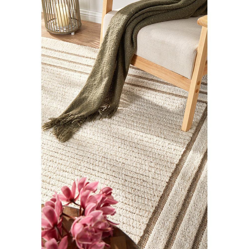 Villa Marin Snow Rug featuring striped textured pattern in cream, beige, taupe, light brown on ivory background, hand-tufted wool