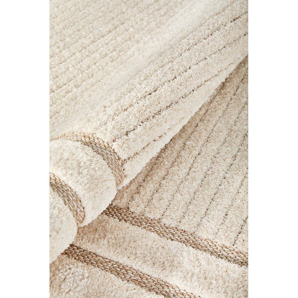 Villa Marin Snow Rug featuring textured striped pattern in cream, ivory and taupe on beige background, machine-made fibre