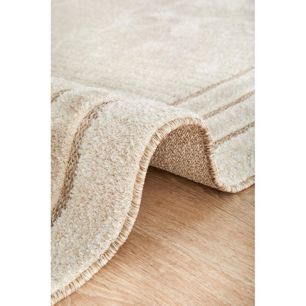 Villa Marin Snow Rug featuring soft striped pattern in ivory, cream and taupe on beige background, hand-tufted wool