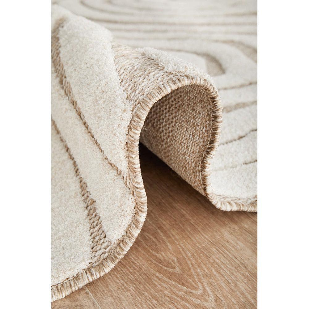 Villa Tani Beige Rug featuring soft striped texture in cream, beige and taupe on light brown floor, hand-tufted wool