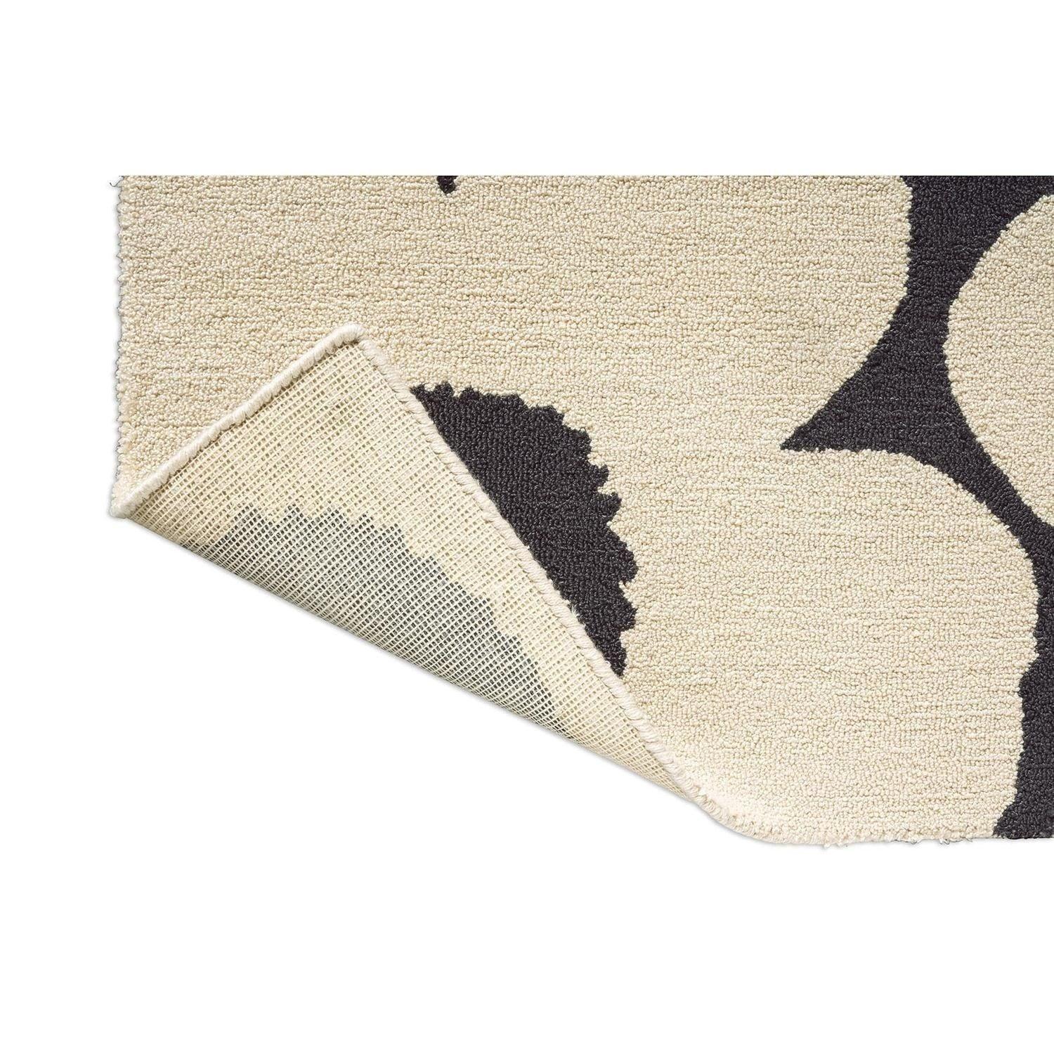 ICONIC RUGS Marimekko Unikko charcoal and ivory outdoor rug. 100% recycled PET, handtufted with a plush pile.
