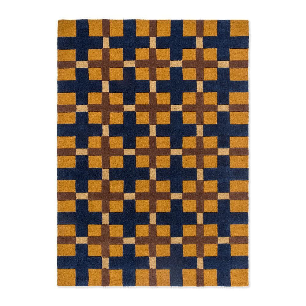 Brink & Campman Decor Milano Golden Ochre Rug featuring geometric lattice in navy, ochre, brown and beige on dark navy, hand-tufted wool