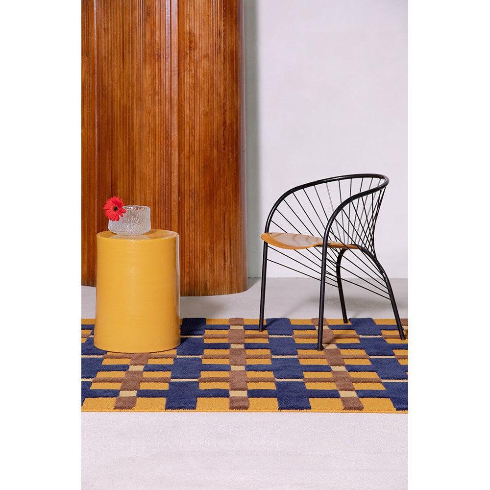 Brink & Campman Decor Milano rug featuring geometric block pattern in royal blue, mustard yellow and chocolate brown on cream background, wool construction