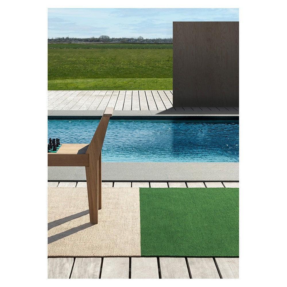 Brink & Campman Deck Spring Green Outdoor Designer Rug featuring patchwork in spring green and beige on tan deck background, power-loomed polypropylene
