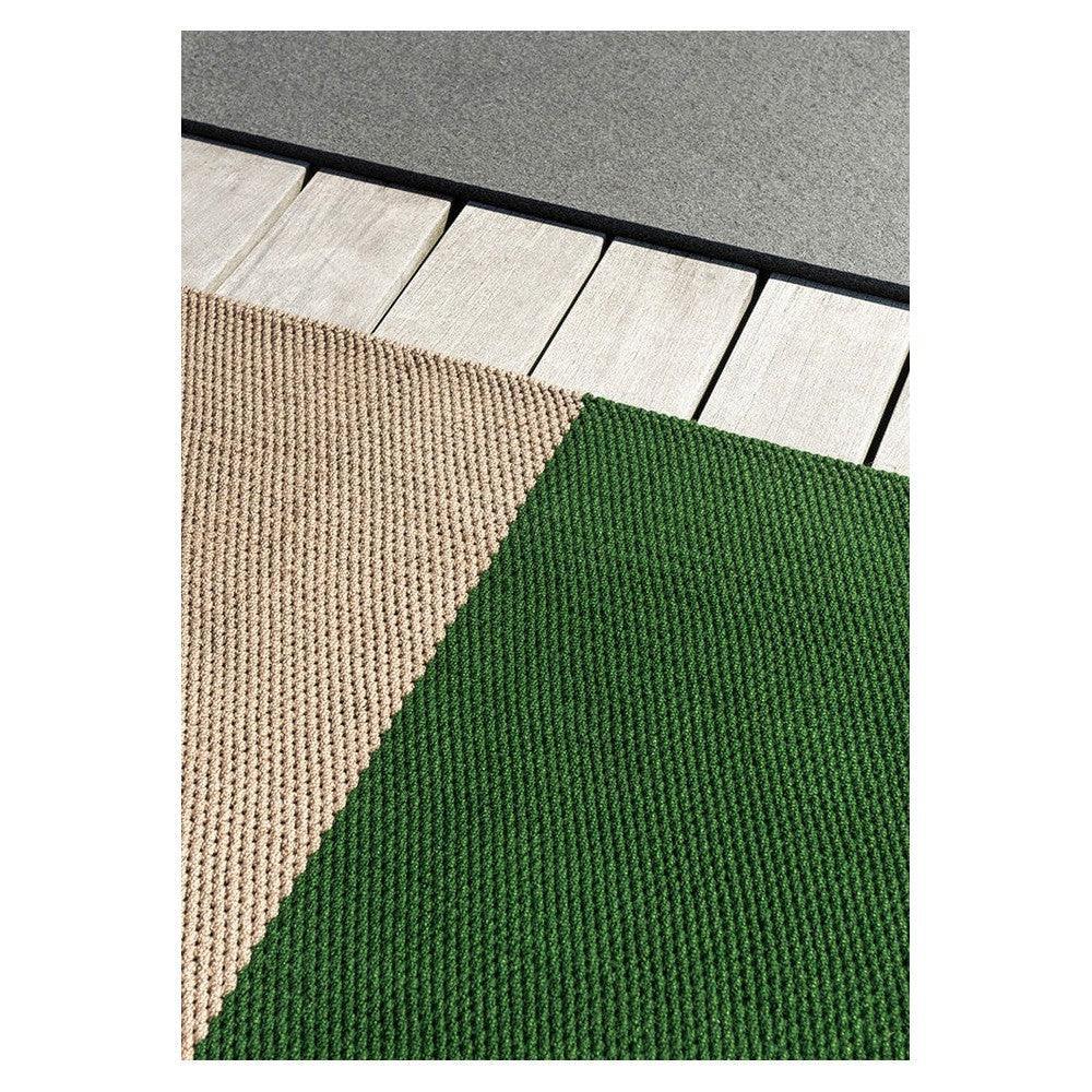 Brink & Campman Deck Spring Green Outdoor Designer Rug featuring color-blocked ribbed pattern in beige and spring green on light deck background, power-loomed polypropylene