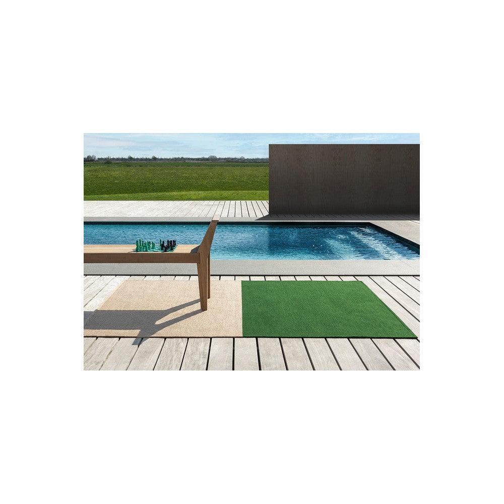 Brink & Campman Deck Spring Green Outdoor Designer Rug featuring solid bright green rectangle in spring-green on light beige decking, polypropylene outdoor rug