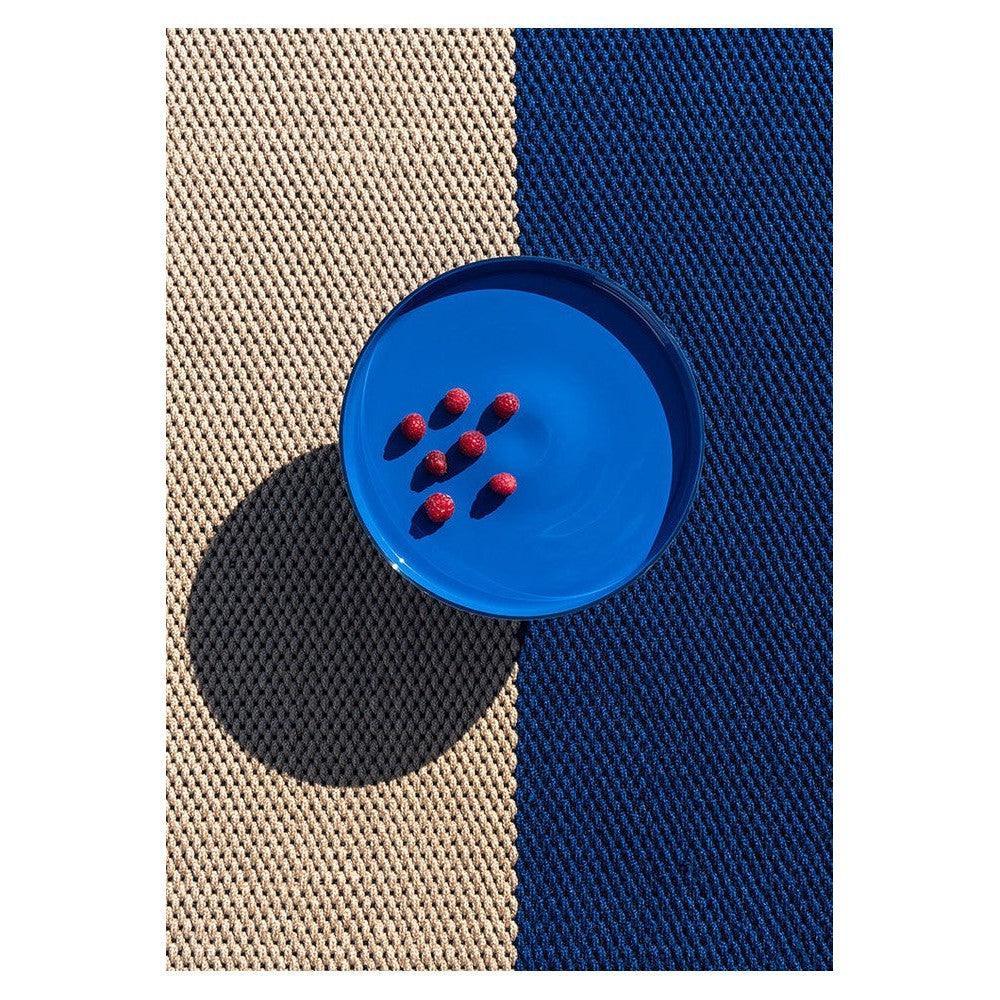 Brink & Campman Deck Electric Blue Outdoor Rug featuring beige and navy striped block pattern on tan background, woven polypropylene