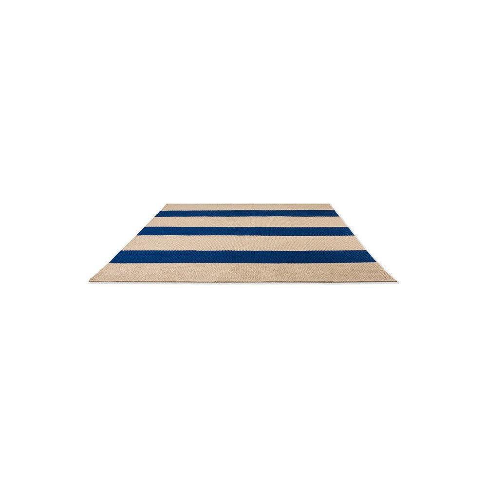 Brink & Campman Deck Electric Blue Outdoor Rug with bold blue stripes on tan background, machine-woven polypropylene