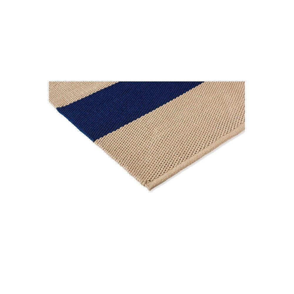 Brink & Campman Deck Electric Blue Outdoor Designer Rug featuring striped pattern in navy blue on beige background, outdoor rug