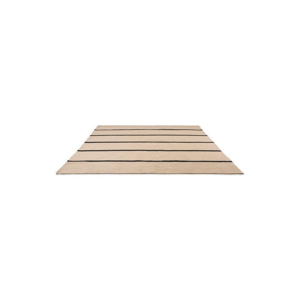 Brink & Campman Deck Charcoal Black outdoor rug featuring striped pattern in charcoal and beige on tan background, power-loomed polypropylene