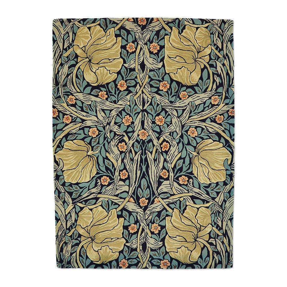 Morris & Co Pimpernel Indigo Rug featuring botanical floral pattern in antique gold, teal, sage green on deep navy, hand-tufted wool