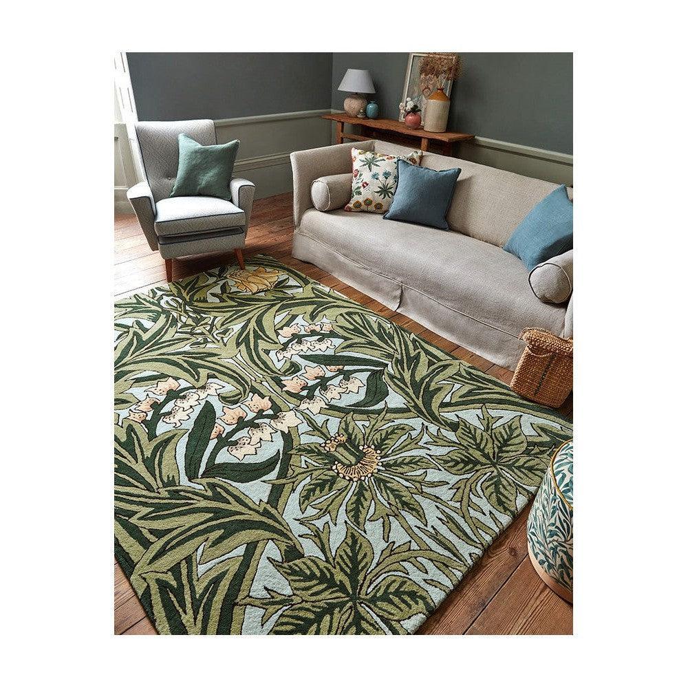 Morris & Co Bluebell Leafy Arbour Green Designer Rug featuring botanical pattern in emerald, sage, olive, mint and cream on pale blue-green background, hand-tufted wool