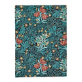 Morris & Co Bower Indigo Designer Rug featuring botanical floral pattern in indigo, teal, coral pink and cream on deep teal background, hand-tufted wool