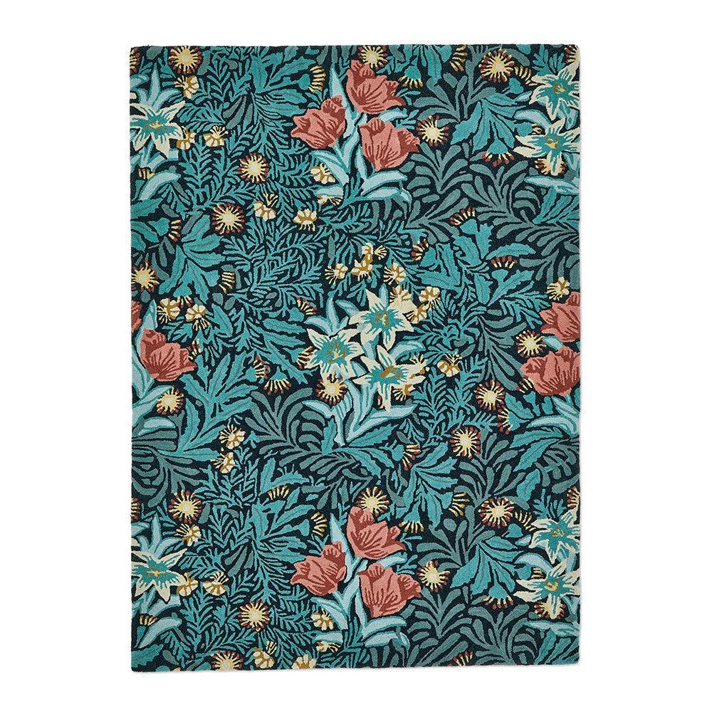 Morris & Co Bower Indigo Designer Rug featuring botanical floral pattern in indigo, teal, coral pink and cream on deep teal background, hand-tufted wool